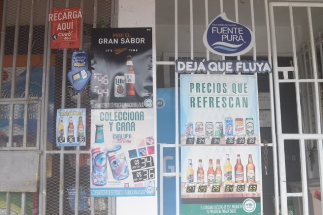 Corner Store covered in Advertising Posters