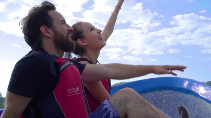 Solentiname Tours Discover Nicaragua Couple on Boat Pointing at Sky