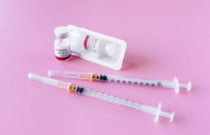 Voluntary Covid-19 Vaccination Program Covid 19 Syringes Pink Background