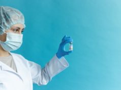 More Sputnik Vaccine for Nicaragua Nurse Holding Vial