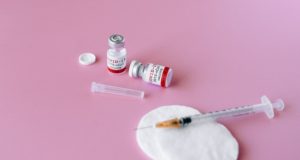 Covid-19 Vaccination Program Needle Swab Vials Pink Background