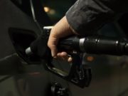 Gasoline Propane Prices Hand on Gas Pump