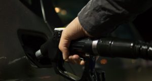 Gasoline Propane Prices Hand on Gas Pump