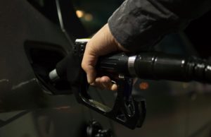 Gasoline Propane Prices Hand on Gas Pump