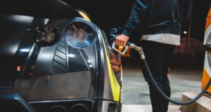 Fuel Price Freeze Person Filling Car at Gas Station