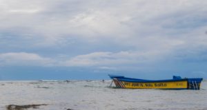 Entering Costa Rica Blue and Yellow Panga Boat at Anchor