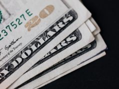Remittances are up 32 percent on same period in 2021 Remittances are up 32 percent-paper-money-on-black-surface