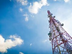 New Telecommunications Law Cell Phone Tower Blue Sky and Clouds