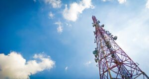 New Telecommunications Law Cell Phone Tower Blue Sky and Clouds