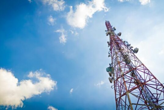 New Telecommunications Law Cell Phone Tower Blue Sky and Clouds