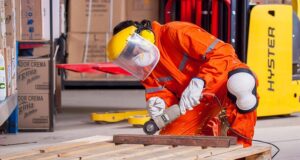 Minimum Wage 2026 Man With Safety Gear Using Grinder